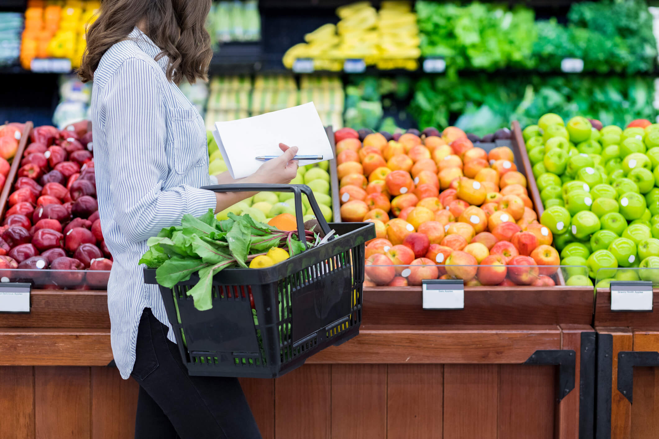 woman grocery shopping with basket